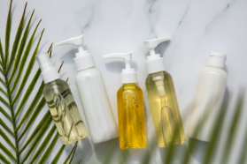 gels and serums in vials next to a plant